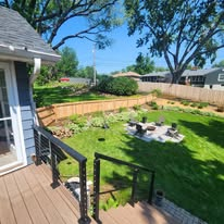Backyard fencing, fire pit and the deck that ties it all together.